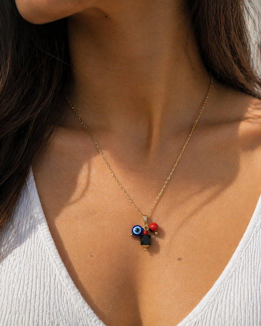 Dije Dorado con Azabache, Ojo Turco y Huayruro - Protección Energética